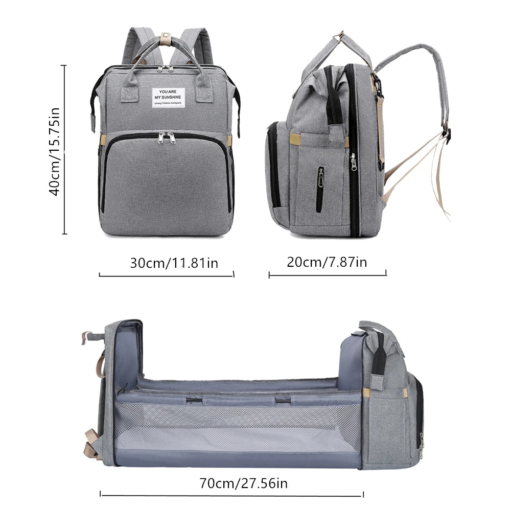 A foldable diaper bag with an insulated changing table pocket and ample storage. Mom's backpack