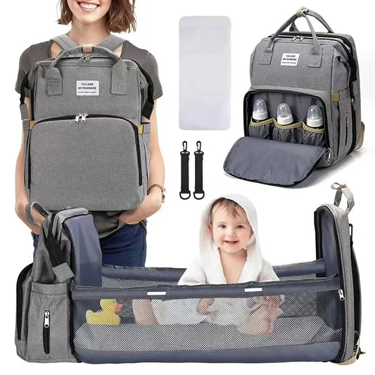 A foldable diaper bag with an insulated changing table pocket and ample storage. Mom's backpack