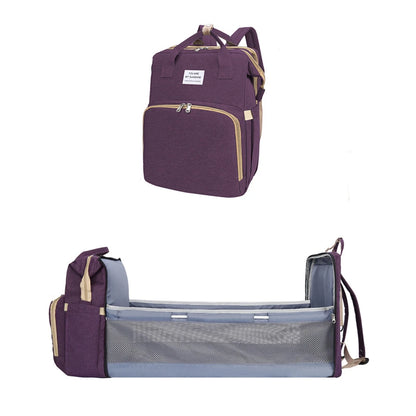 A foldable diaper bag with an insulated changing table pocket and ample storage. Mom's backpack