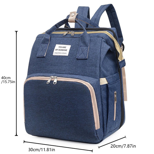 A foldable diaper bag with an insulated changing table pocket and ample storage. Mom's backpack