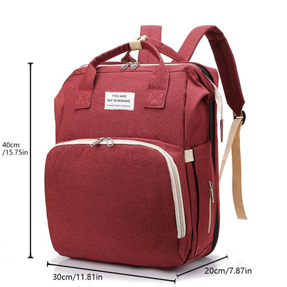 A foldable diaper bag with an insulated changing table pocket and ample storage. Mom's backpack